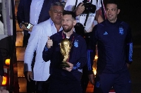 Lionel Messi with the World Cup trophy