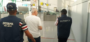 The fraudster and Interpol officers