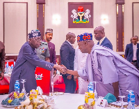 President Bola Tinubu in a handshake with the APC National Chairman Nentawe Yilwatda