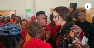 Bianca Ojukwu dancing with prisoners in Ethiopia