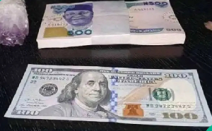 File photo of naira and dollar notes