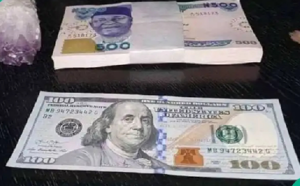 File photo of naira and dollar notes