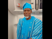Reno Omokri putting on Aso Oke
