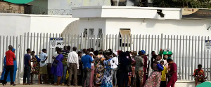 File photo of customers trooping into a bank