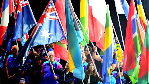 Athletes carry their country flags during the Closing Ceremony of Glasgow 2026 Commonwealth Games