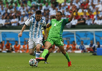 Lionel Messi and Peter Odemwingie during the 2014 FIFA World Cup