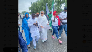 Natasha in white on her way into the Senate premises
