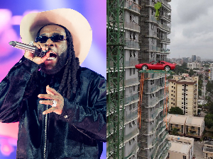 Burna Boy had his Ferrari lifted by crane