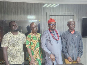 Obi of Lagos on red cap and other suspects at a police station