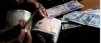 File photo of dollar and naira notes