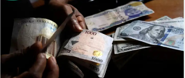 File photo of dollar and naira notes