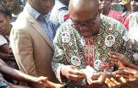 Peter Obi sharing money to people