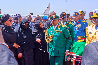 Mourners receiving Buhari's remains