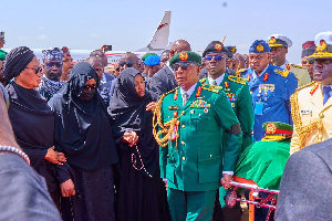 Mourners receiving Buhari's remains