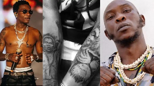 Wizkid and Seun Kuti on Fela's tattoo