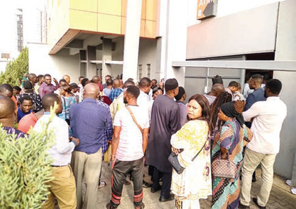 Customers waiting to withdraw new naira notes