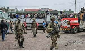 M23 rebels escort govt soldiers and police who surrendered to an undisclosed location in Goma