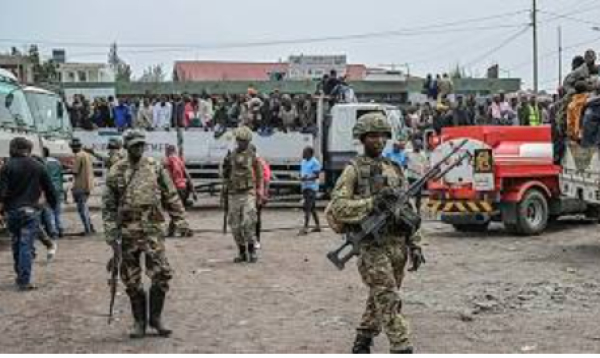M23 rebels escort govt soldiers and police who surrendered to an undisclosed location in Goma
