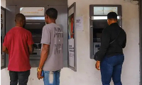 Photo of people using ATM machine