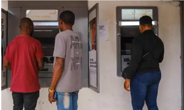 Photo of people using ATM machine