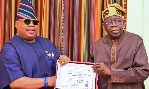 Osun State Governor, Ademola Adeleke, presenting his return certificate to President Bola Tinubu