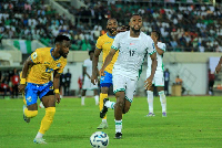 Alex Iwobi in action against Gabon
