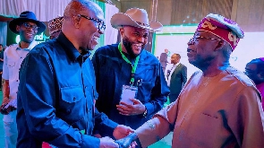 Peter Obi in a handshake with Bola Tinubu