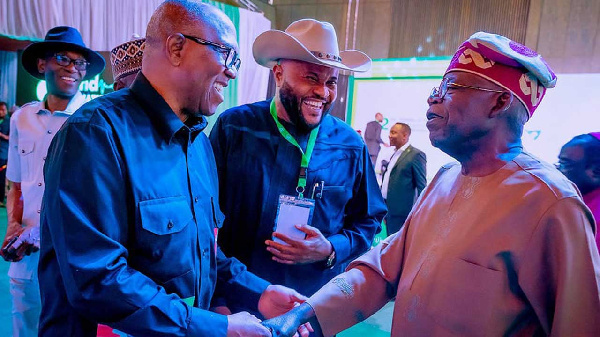 Peter Obi in a handshake with Bola Tinubu