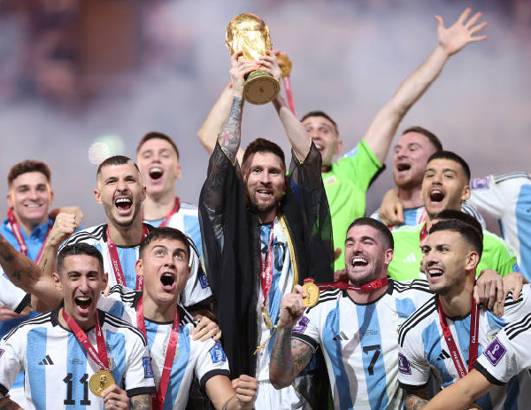 Lionel Messi with the World Cup trophy