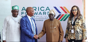 President Tinubu shaking hands with CAF President Motsepe