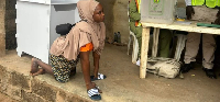 Physically challenged voter, Aminat Akinsola at the polling unit   Photo: Nigerian Tribune
