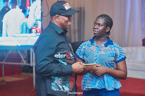 Peter Obi receiving donation from a student