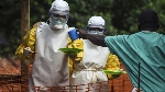 File image of health workers wearing protective suits and mask