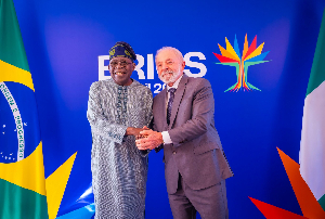 President Bola Tinubu in a handshake with President Luiz Inácio Lula da Silva of Brazil