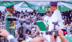 Former president Muhammadu Buhari with President Bola Tinubu